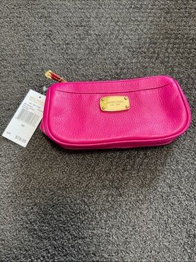 Michael Kors Hot Pink Pebbled Leather Cosmetic Pouch 
Jet Set travel pouch